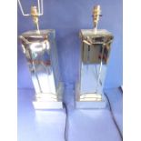 A pair of modern square mirror-fronted table lamps on square plinth-style bases (approx. 40.5cm high