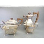 A heavy four-piece tea service comprising teapot, hot-water jug, milk jug and two-handled sugar,
