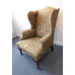 An early 20th century wing-backed armchair in early 18th century-style; tapestry-style upholstery