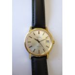 A gentleman's Omega dress wristwatch; gold-plated case and then signed dial with baton markers and