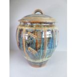 Jane O' Clark studio pottery; a barrel-shaped lidded food container, the lid with loop handle