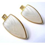 A pair of frosted glass and diamond-set ear pendants, each designed as a moulded shield to the