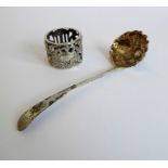 An early 19th century hallmarked silver berry-spoon-type ladle with gilded interior bowl, together