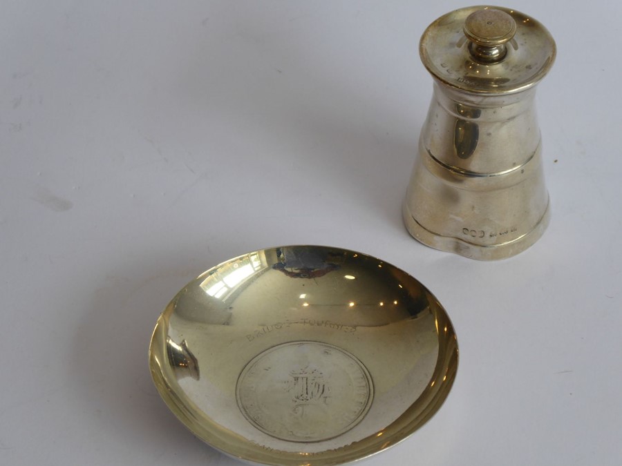 An early 20th century hallmarked silver pepper grinder in the shape of a milk churn (dents to base),