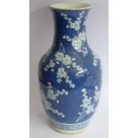 A late 19th century Chinese porcelain vase of baluster form; hand-decorated in underglaze blue