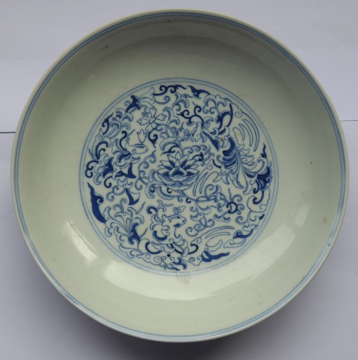 A circular Chinese porcelain blue-and-white dish; six-character mark of Daoguang and of the