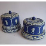 Two 19th century (one large and one small) blue and white Jasperware Stilton covers and stands;