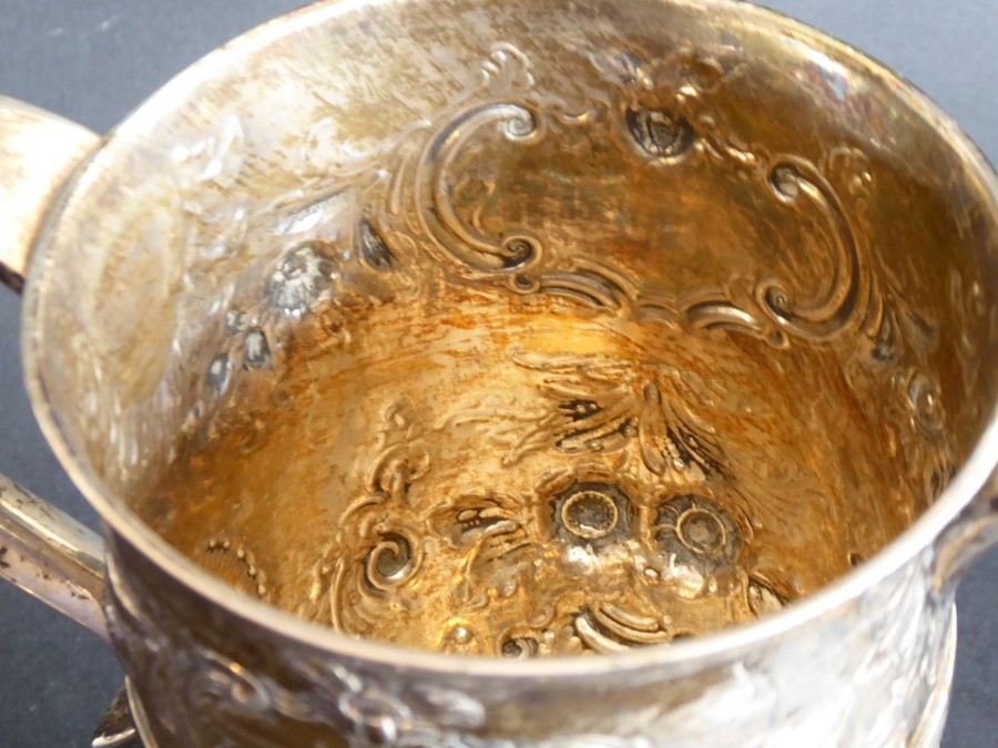 An 18th century hallmarked silver two-handled trophy-style cup; later Repoussé decorated and with - Image 3 of 11