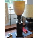 Maitland Smith Lighting; a marblised satin glass table torchère, a black marble base (68cm high x