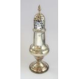 An 18th century hallmarked silver baluster-shaped caster; having pierced domed cover, acorn-style