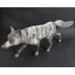 A large, striking and hallmarked silver (filled) model of a prancing fox with tail aloft; fully