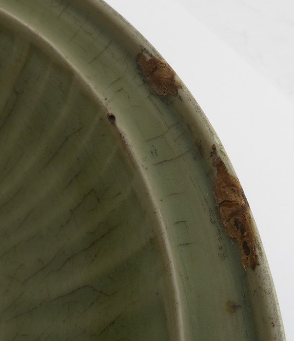 A large early 17th century Chinese Longquan bowl with celadon glaze; the moulded lip above a - Image 4 of 5