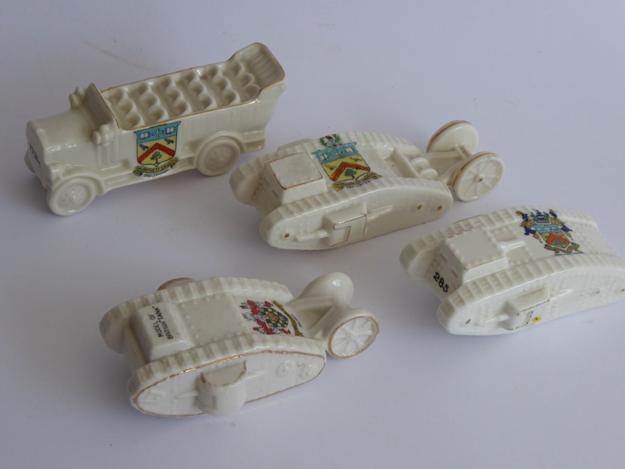Three Arcadian and one Willow Art crested china models: the Arcadian models comprising two WWI tanks