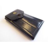 A rare and collectable 'Slidaway' pocket vanity case; black-leather case with early Concorde