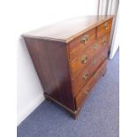 An 18th century oak chest; the planked moulded top above two half-width over three full-width