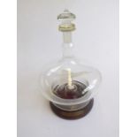 A rare 'Concorde in a bottle’; in the form of a decanter and with turned wood base (the stopper