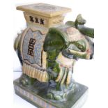 A large Chinese stoneware jardinière stand modelled as a trumpeting elephant; the central howdah