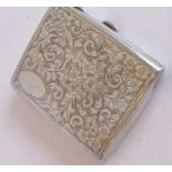 A finely engraved cigarette case; scrolling foliate decoration and vacant oval cartouche, assayed