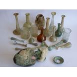 An interesting collection of early Roman glassware; to include tear bottles, perfume bottles,