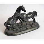 A 20th century Russian painted, cast-iron sculpture model of two horses; marks to underside and