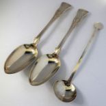 A pair of heavy mid 19th century hallmarked silver serving spoons; double-struck in the King's
