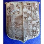 A very heavy solid patinated bronze wall mounting armorial crest; of shield design and with lion