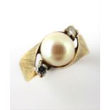 A 14-carat gold pearl and diamond ring