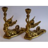 A fine pair of heavy early/mid-19th century lacquered gilt-bronze figural candlesticks; two winged