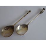 Two early-style hallmarked silver (17th/18th century) seal top spoons; the slightly larger (18cm)