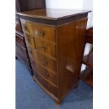 An early 20th century bow-fronted mahogany chest of Georgian III inspiration; the outset reeded edge