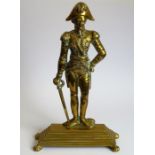 A late 19th/early 20th century brass doorstop modelled as The Duke of Wellington in full regalia and