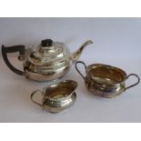 A heavy hallmarked silver three-piece tea service: teapot, two-handled sugar and milk jug; maker's