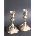 A matched pair of hallmarked silver (weighted) candlesticks; in 18th century style with detachable