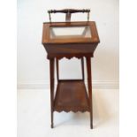 An unusual late 19th century bijouterie cabinet: rosewood and boxwood-strung and of pitched roof