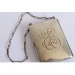 A late 19th century silver aide-mémoire dress purse on chain; the central cartouche engraved with