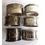 Six hallmarked silver napkin rings: a pair of heavy hallmarked examples with Celtic bands, another