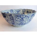 A large 17th century Chinese porcelain bowl hand decorated in underglaze blue and white with