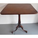 A Georgian rectangular tilt-top mahogany occasional table; the early 19th century reeded edge