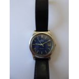 A gentleman's steel-cased Omega Automatic Geneva wristwatch; the blue signed dial with baton markers