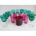 Eleven 19th century green glass wines, together with five cranberry glass-style tapering beakers and