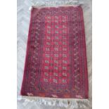 A red ground Afghan carpet with gul pattern (north Afghanistan) (178cm x 106cm)