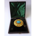 A mid-19th century yellow gold and turquoise brooch, circa 1840, the central oval dome set with a