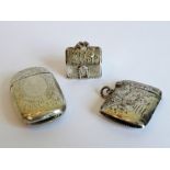 Two hallmarked silver vesta cases, both engraved with foliate designs, together with a modern