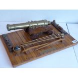 An excellent scale model of an English brass 32 pdr. deck cannon (originally circa 1780); the