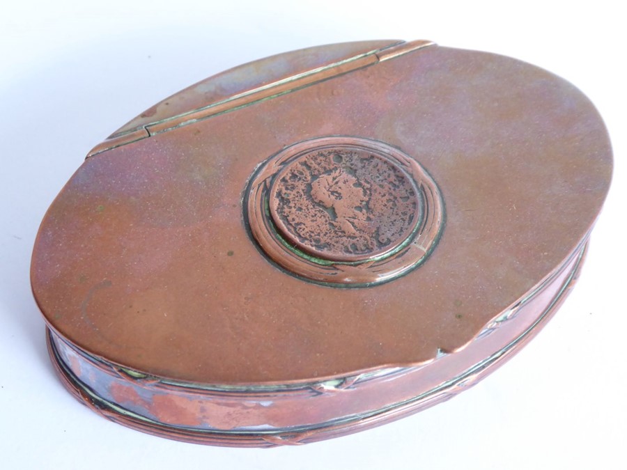A 19th century oval copper (once silver plated) table snuff box; the lid inset with a worn early