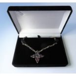 A garnet pendant and chain link necklace set throughout with garnet-set navette collets, the chain