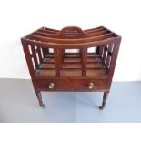 An early 19th century George III period four-division mahogany Canterbury; the top of concave