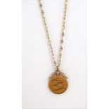 A half-sovereign pendant and 9-carat gold chain, stamped '3.75', 1899 half-sovereign worn