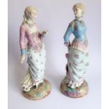 Two large hand-decorated Continental porcelain figure models; each with hair tied back and