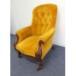 A large Willian IV period spoon-back armchair; upholstered button-back and mahogany show-wood frame,